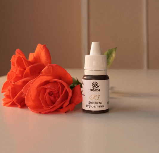 Savich R line inorganic based eyebrow pigment for permanent makeup. 10ml ink bottle with red flower on the table. Peramenent Makeup pigment.